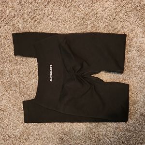 Dark green alphalete amplify leggings.